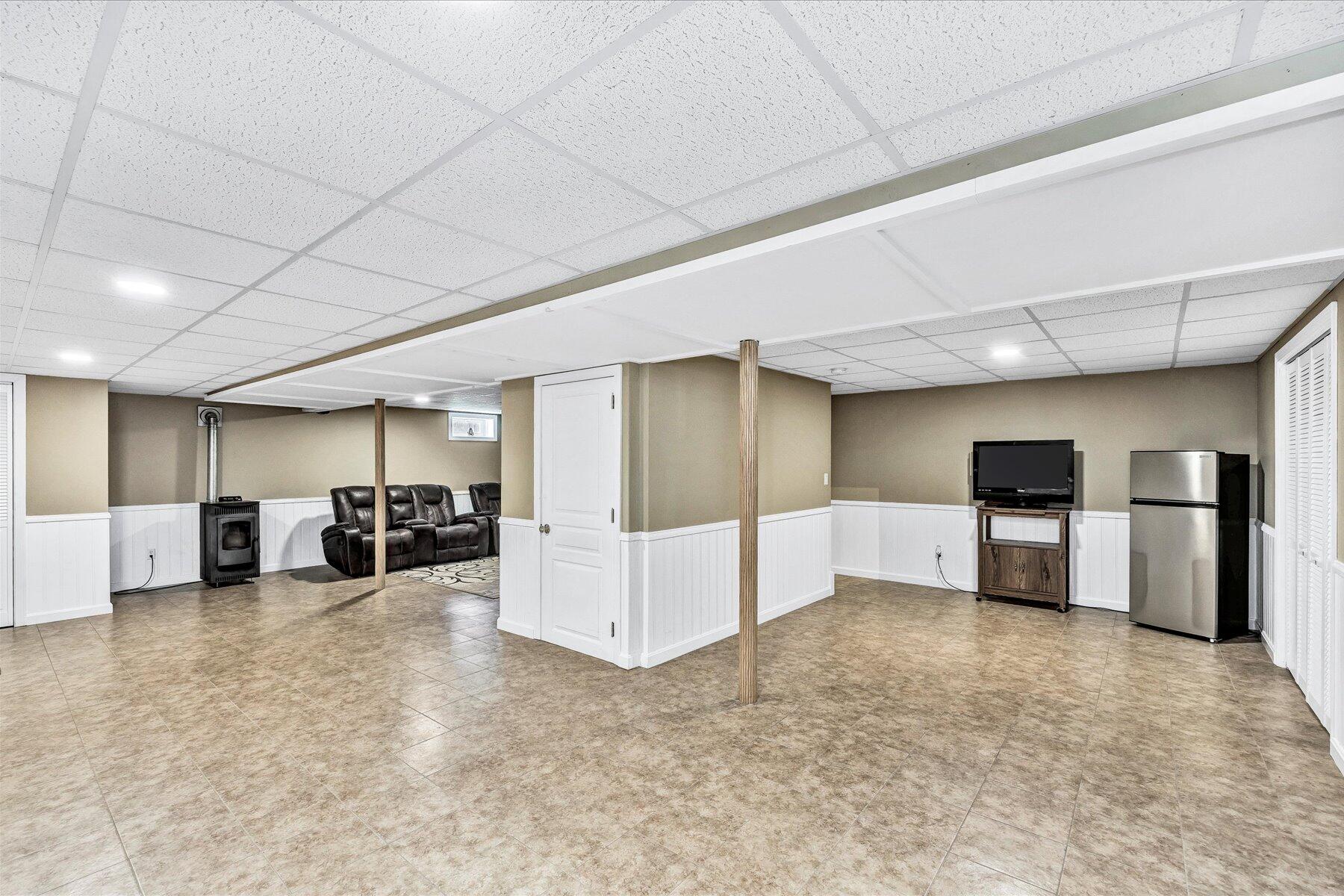 127 South Sandwich Road Mashpee, MA 02649 - Photo 37 of 55 a room with furniture and a flat screen tv