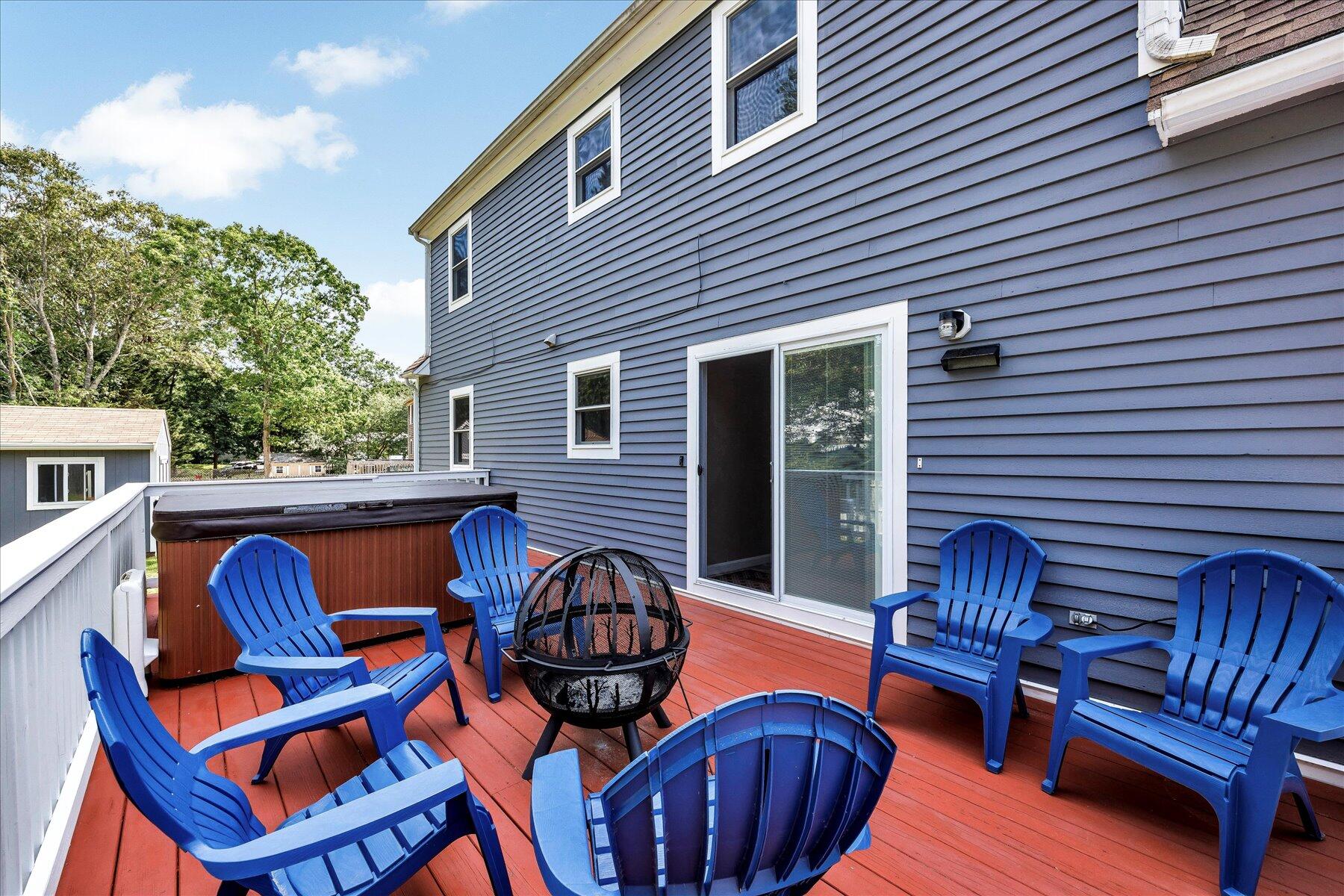 127 South Sandwich Road Mashpee, MA 02649 - Photo 40 of 55 a view of a patio with couches chairs and a wooden floor