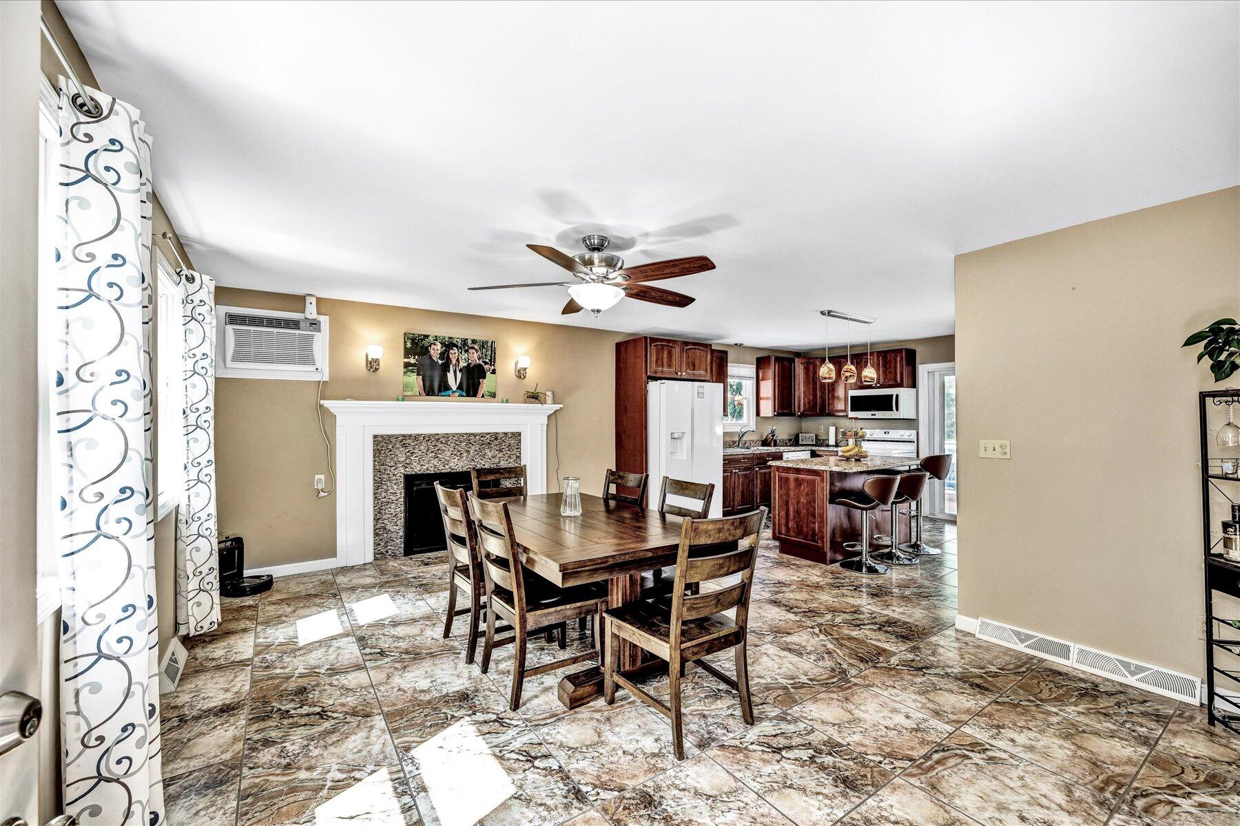 127 South Sandwich Road Mashpee, MA 02649 - Photo 5 of 55 a view of a livingroom with furniture and a fireplace
