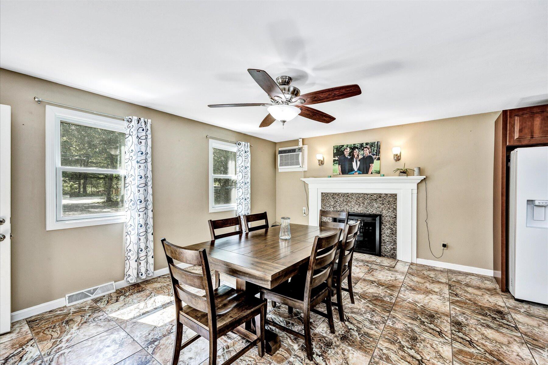 127 South Sandwich Road Mashpee, MA 02649 - Photo 6 of 55 a view of a dining room with furniture window and wooden floor
