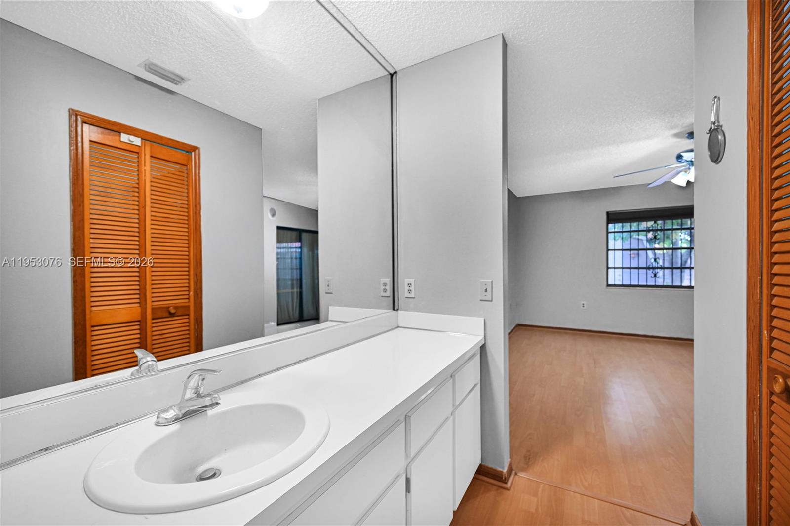 14837 Southwest 60th Street Miami, FL 33193 - Photo 14 of 21 a bathroom with a sink and a mirror
