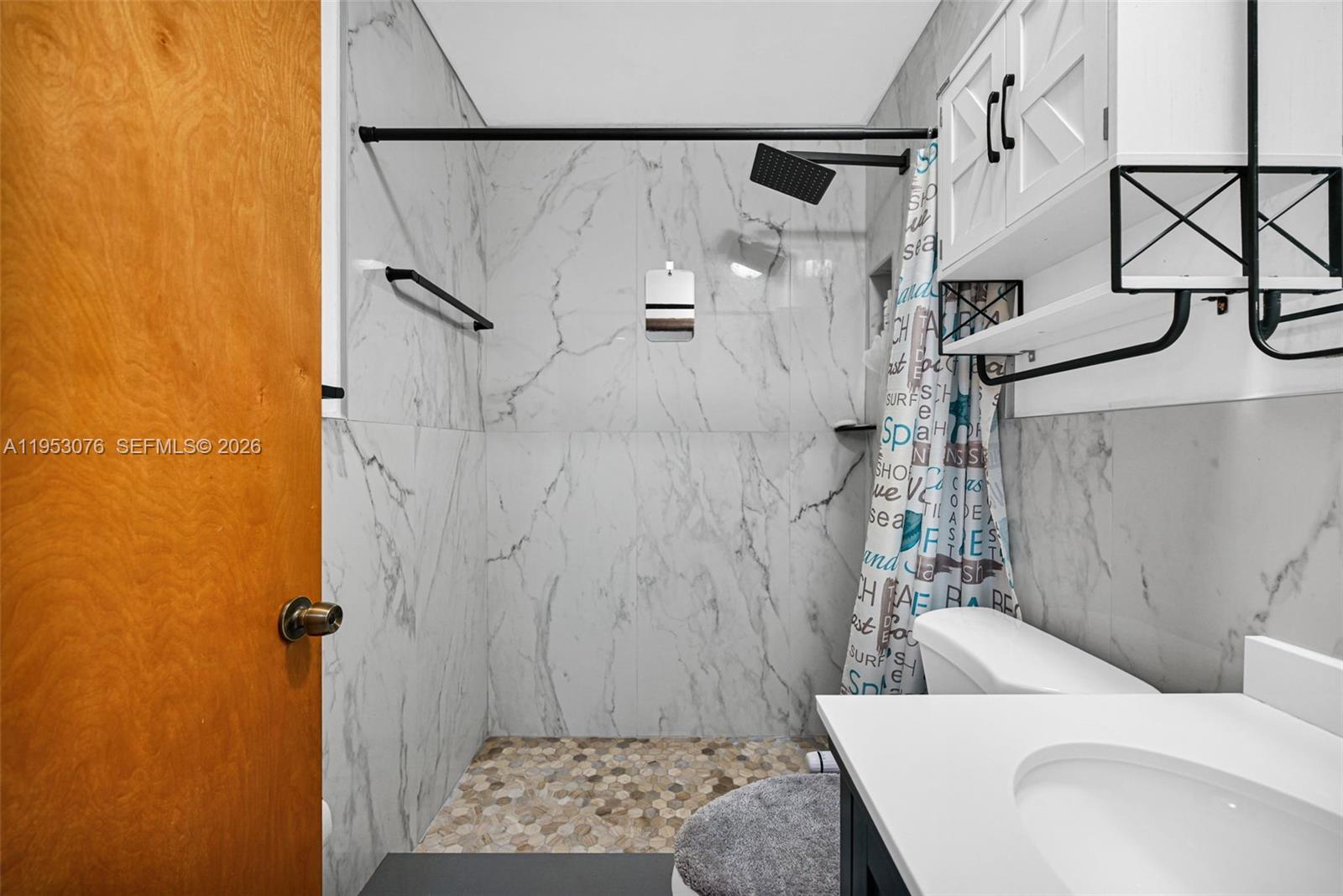 14837 Southwest 60th Street Miami, FL 33193 - Photo 17 of 21 a bathroom with a bathtub and shower