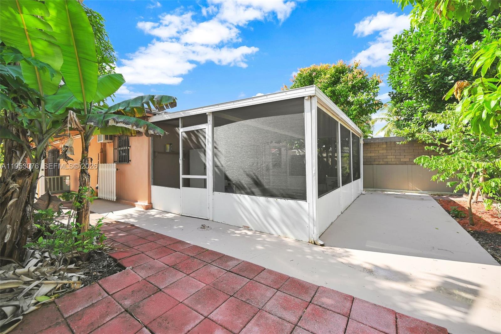14837 Southwest 60th Street Miami, FL 33193 - Photo 5 of 21 a view of a house with a yard