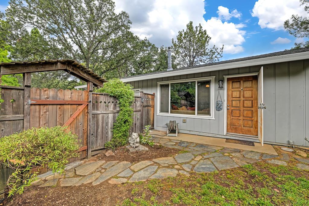 6689 Rhodes Avenue Placerville, CA 95667 - Photo 3 of 60 a house with trees in the background