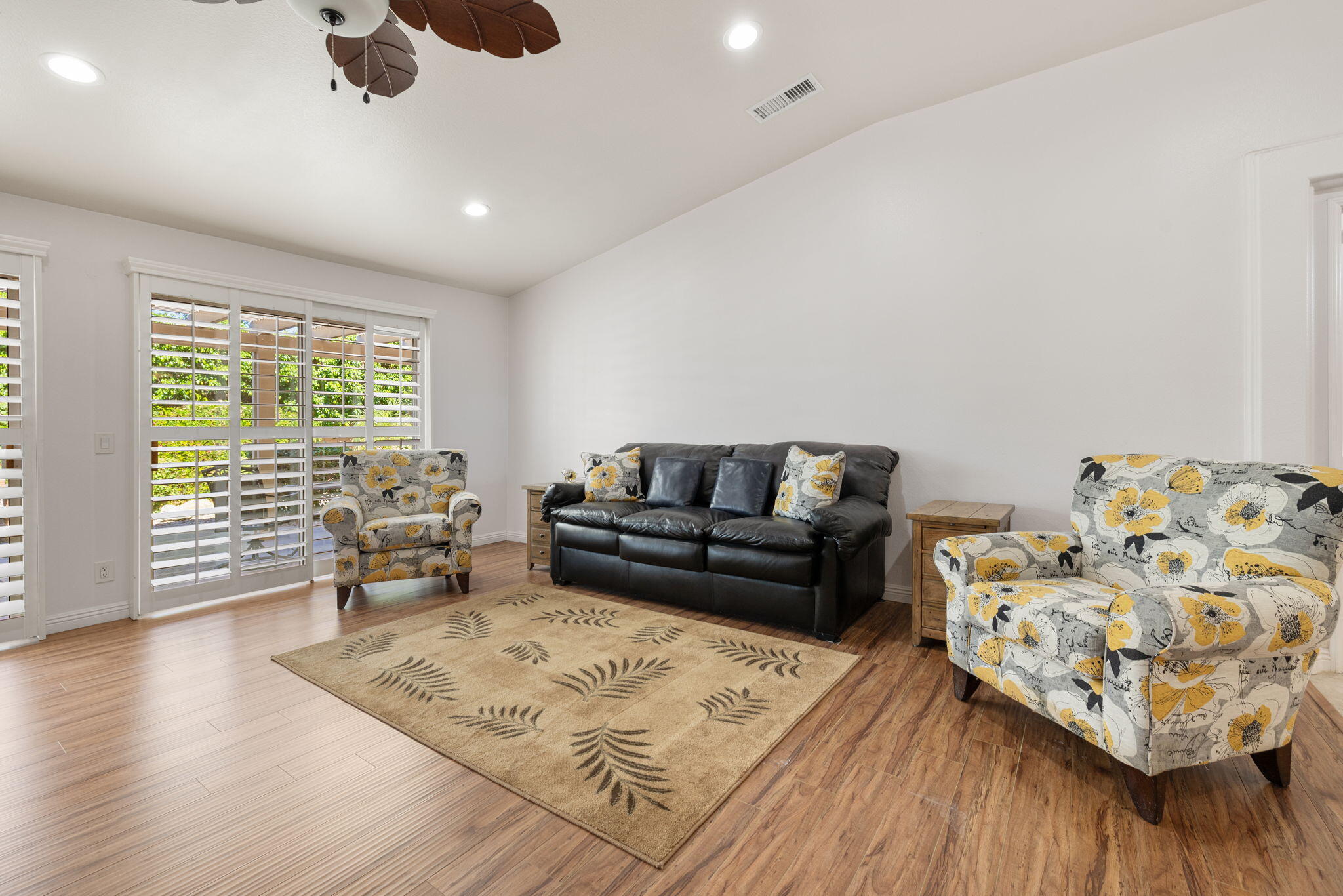 82420 Astaire Avenue Indio, CA 92201 - Photo 12 of 61 a living room with furniture and wooden floor