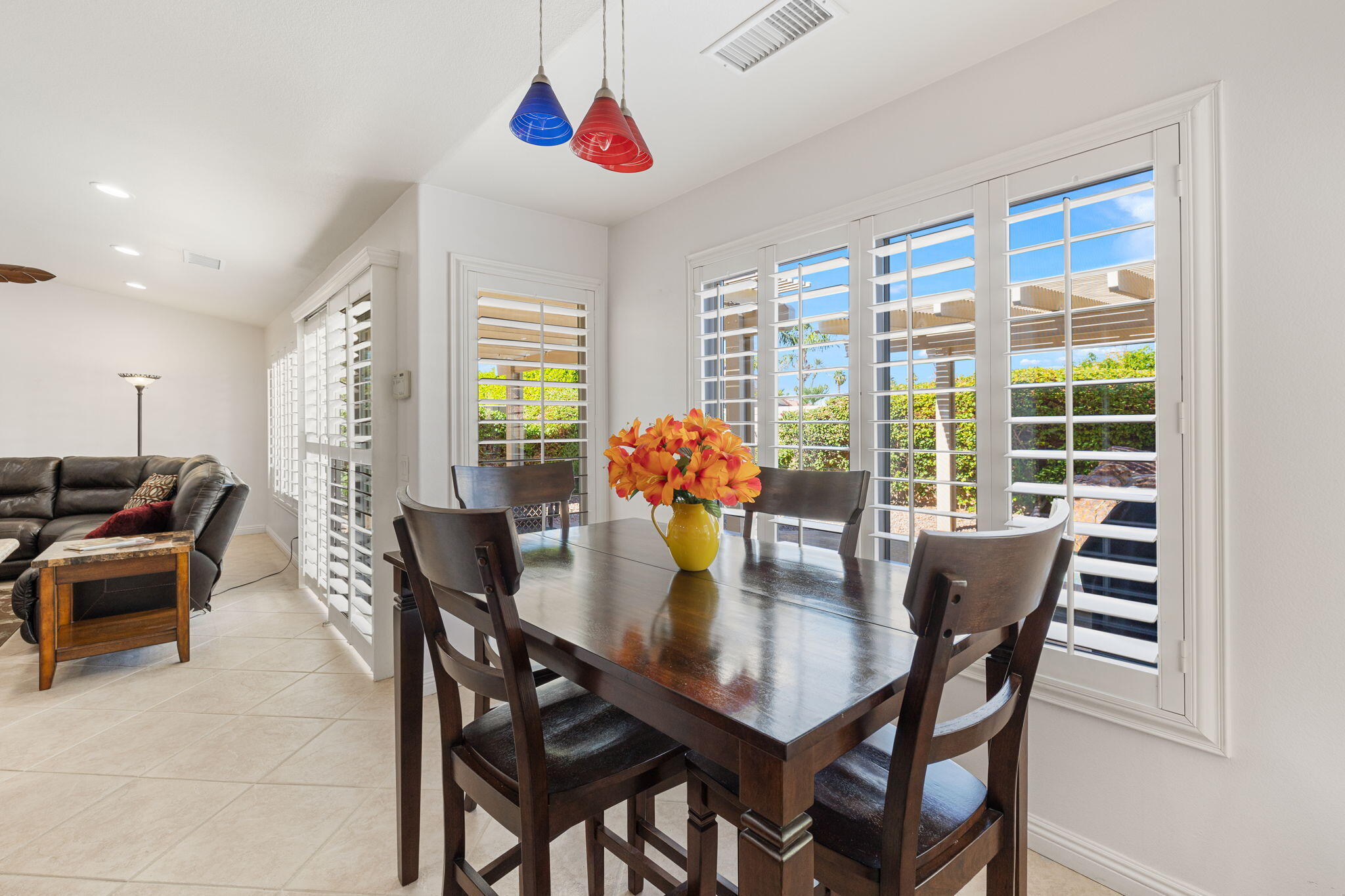 82420 Astaire Avenue Indio, CA 92201 - Photo 13 of 61 a view of a dining room with furniture window and outside view