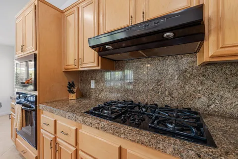a kitchen with a stove and a cabinet