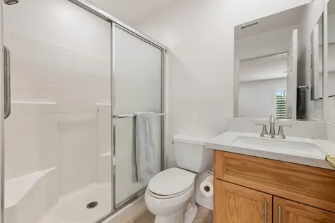 a spacious bedroom with a bed and a couch