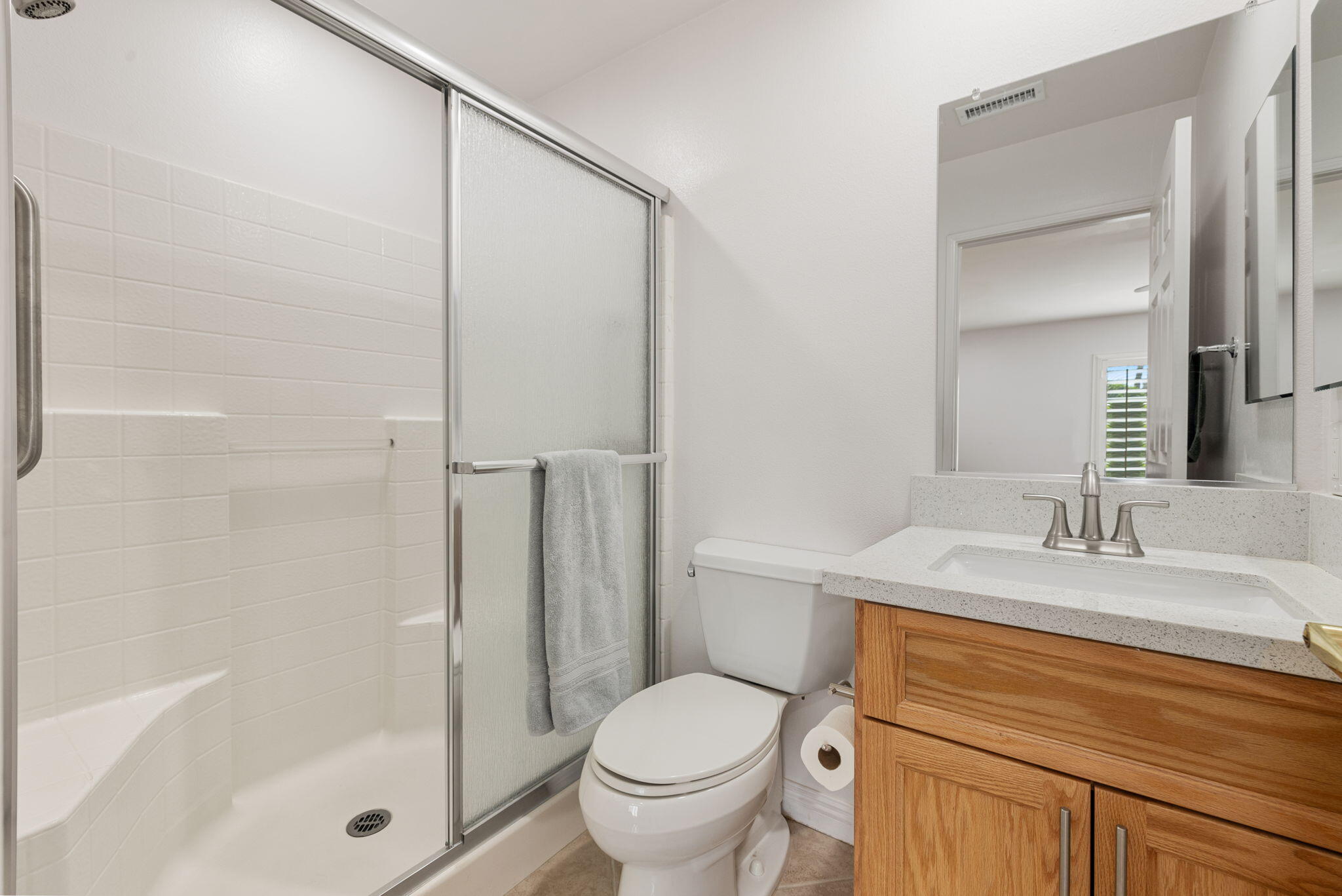 82420 Astaire Avenue Indio, CA 92201 - Photo 23 of 61 a bathroom with a granite countertop sink toilet and shower