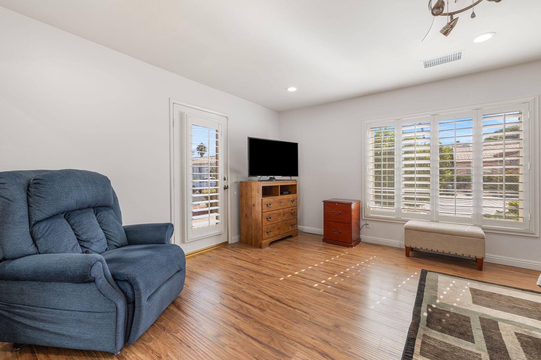 82420 Astaire Avenue Indio, CA 92201 - Photo 26 of 61 a living room with furniture and a flat screen tv