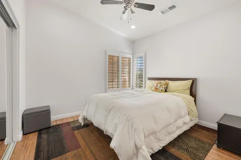 a bedroom with two beds and a window