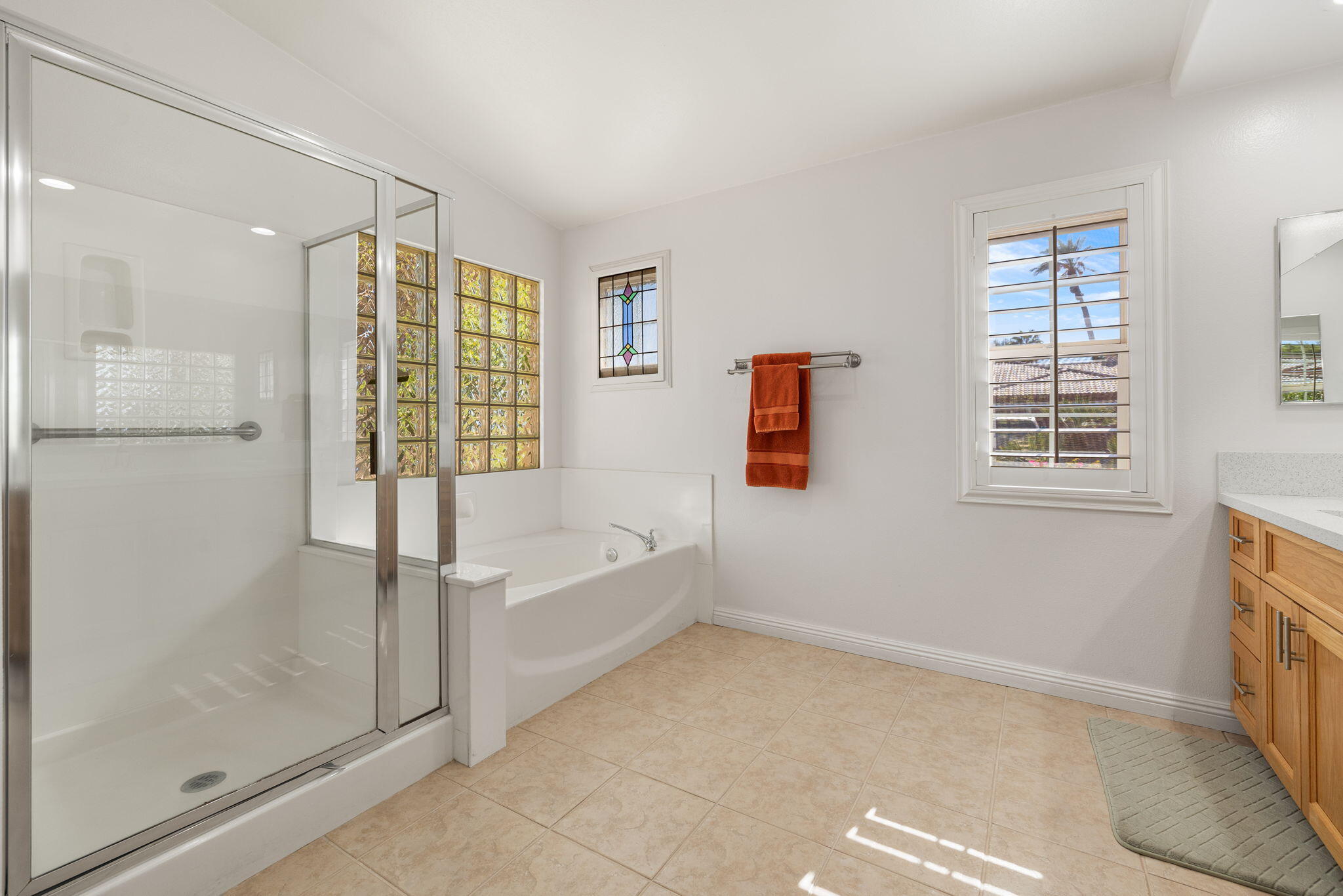 82420 Astaire Avenue Indio, CA 92201 - Photo 31 of 61 a bathroom with a bathtub and a shower