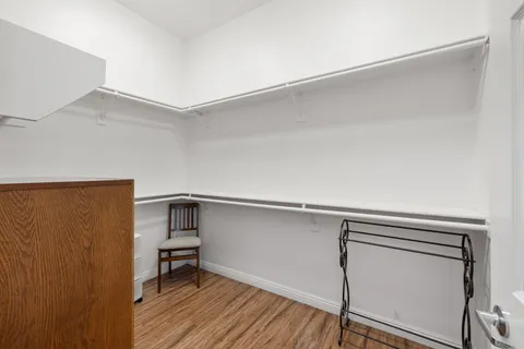 a bedroom with a bed and a flat screen television