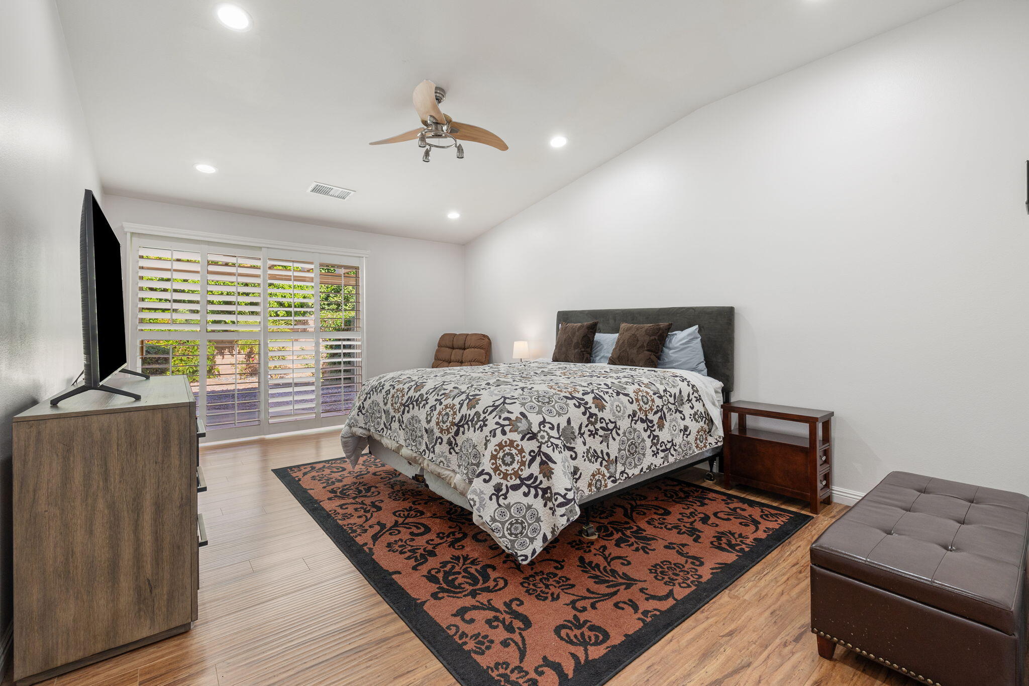 82420 Astaire Avenue Indio, CA 92201 - Photo 35 of 61 a bedroom with a bed and a flat screen television