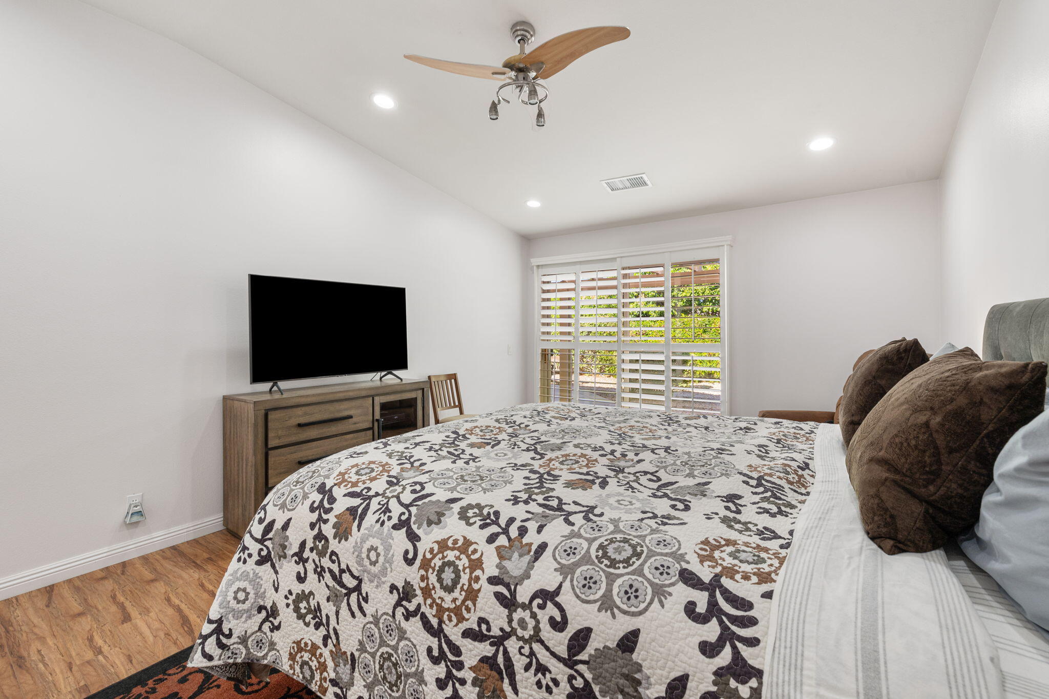 82420 Astaire Avenue Indio, CA 92201 - Photo 36 of 61 a bedroom with a bed and a flat screen tv