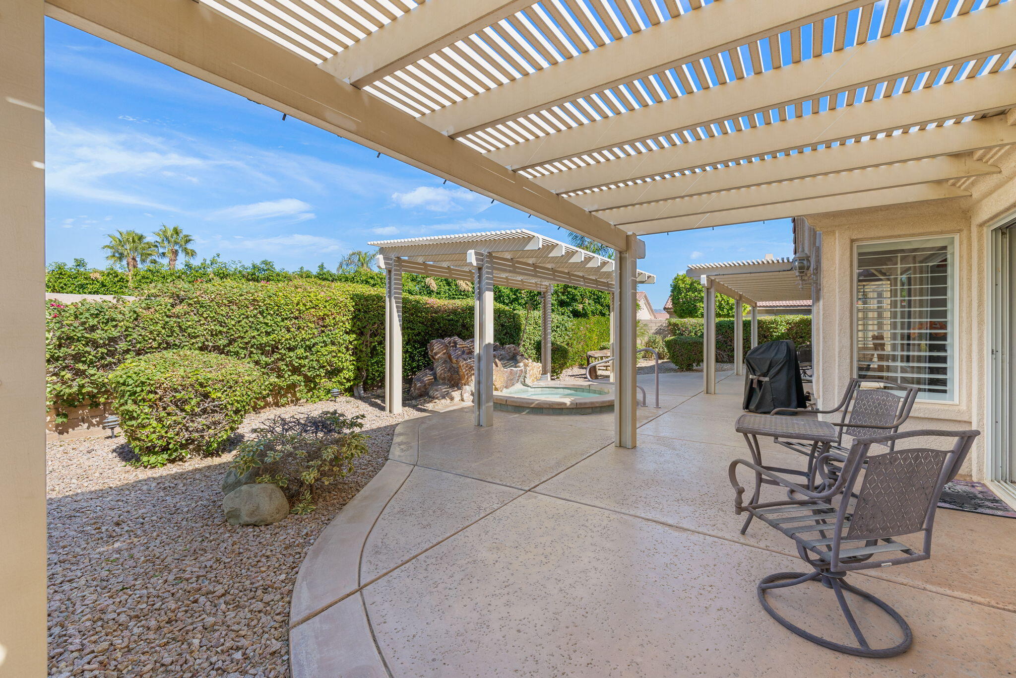 82420 Astaire Avenue Indio, CA 92201 - Photo 38 of 61 a building outdoor space with patio furniture and potted plants