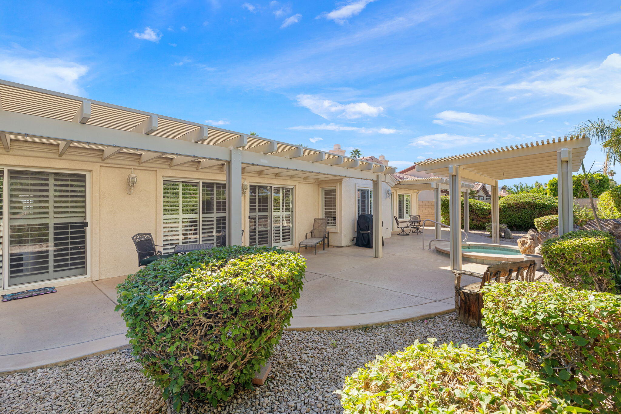 82420 Astaire Avenue Indio, CA 92201 - Photo 39 of 61 a front view of a house with garden