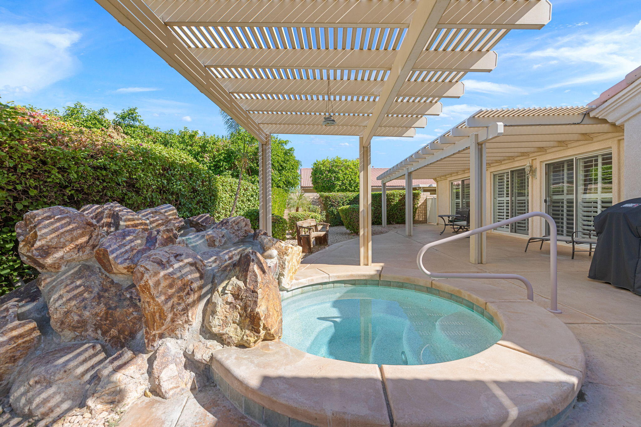 82420 Astaire Avenue Indio, CA 92201 - Photo 45 of 61 a view of a swimming pool with a patio