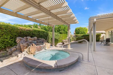 an aerial view of a residential apartment building with a yard