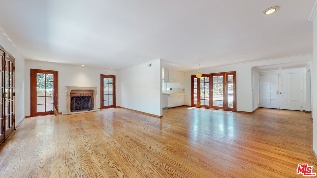 4535 El Prieto Road Altadena, CA 91001 - Photo 12 of 41 a view of an empty room with wooden floor and a window