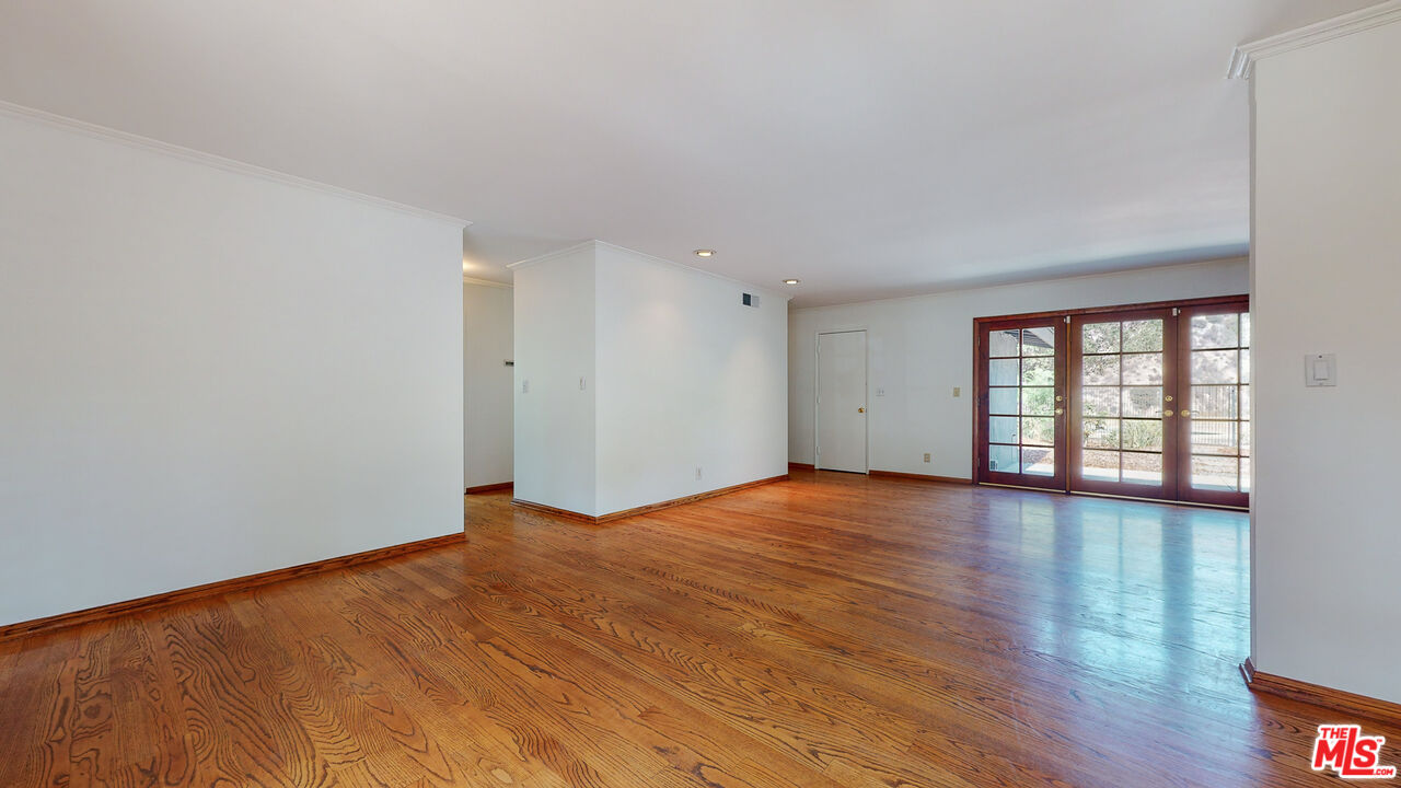 4535 El Prieto Road Altadena, CA 91001 - Photo 15 of 41 a view of an empty room with wooden floor and a window