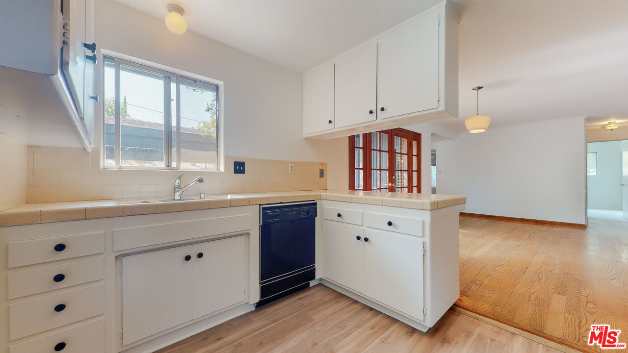 4535 El Prieto Road Altadena, CA 91001 - Photo 18 of 41 a hall with a sink cabinets and a window