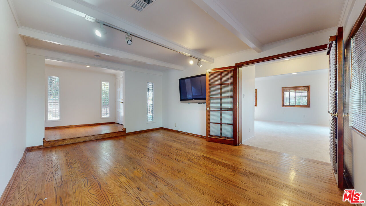 4535 El Prieto Road Altadena, CA 91001 - Photo 20 of 41 a view of empty room with wooden floor and window