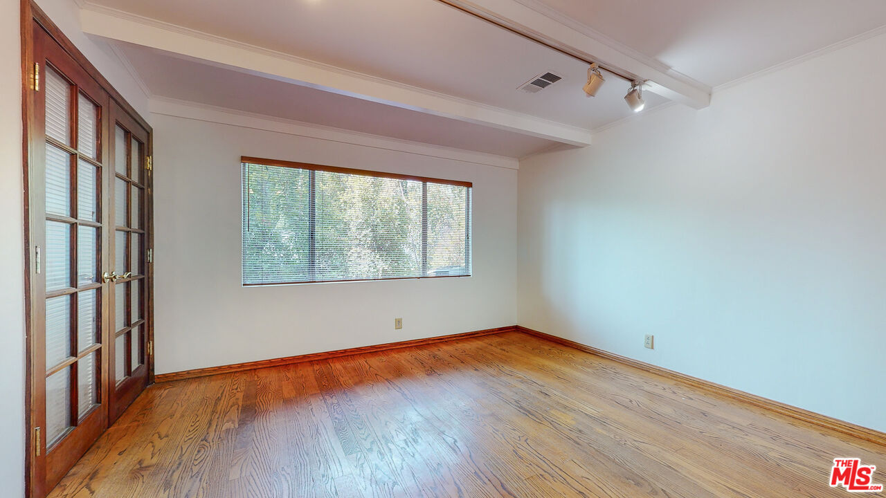 4535 El Prieto Road Altadena, CA 91001 - Photo 21 of 41 a view of an empty room with wooden floor and a window