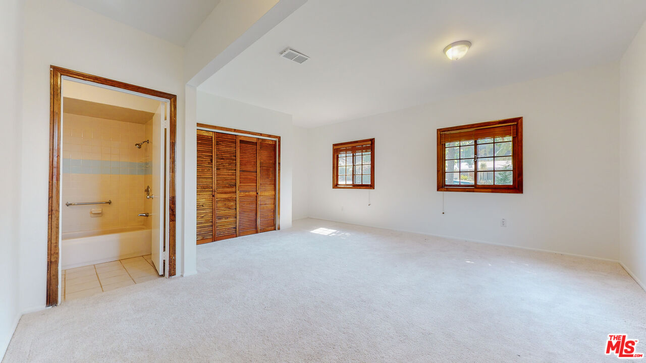 4535 El Prieto Road Altadena, CA 91001 - Photo 22 of 41 an empty room with windows and closet
