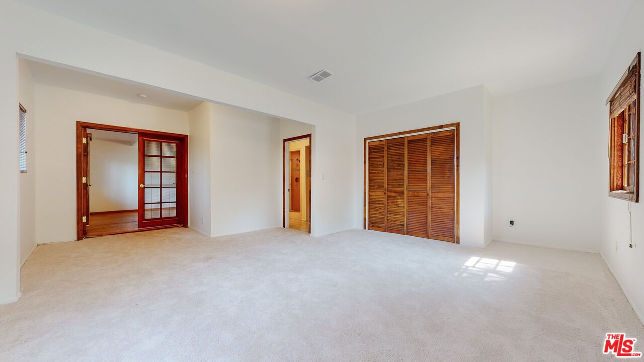 4535 El Prieto Road Altadena, CA 91001 - Photo 23 of 41 an empty room with windows and closet