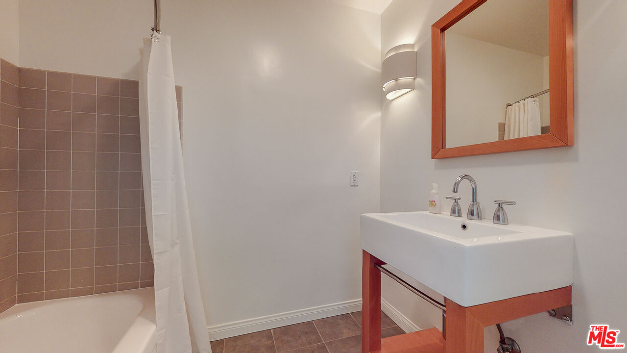 4535 El Prieto Road Altadena, CA 91001 - Photo 29 of 41 a bathroom with a sink a mirror and a bathtub