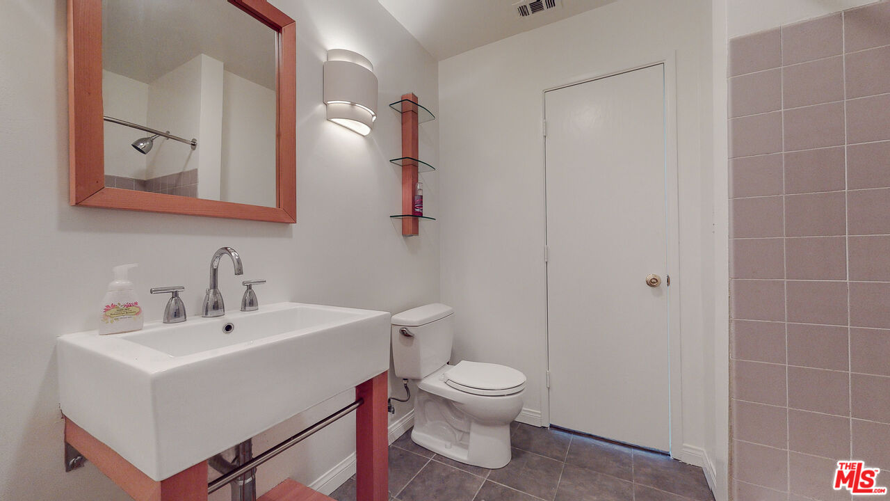 4535 El Prieto Road Altadena, CA 91001 - Photo 30 of 41 a white toilet sitting next to a bathroom sink