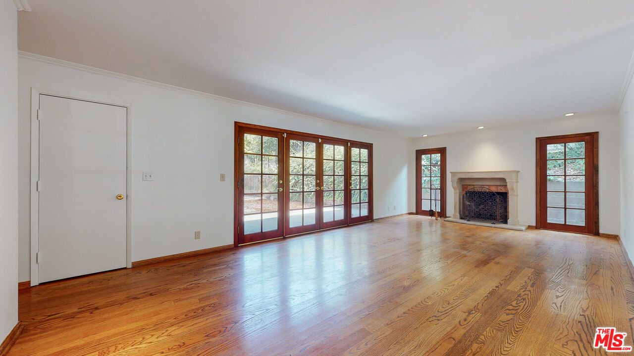 4535 El Prieto Road Altadena, CA 91001 - Photo 8 of 41 a view of an empty room with wooden floor and a window