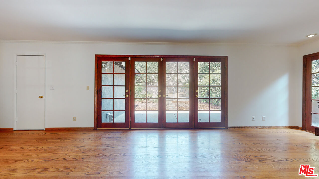 4535 El Prieto Road Altadena, CA 91001 - Photo 9 of 41 a view of an empty room with wooden floor and a window