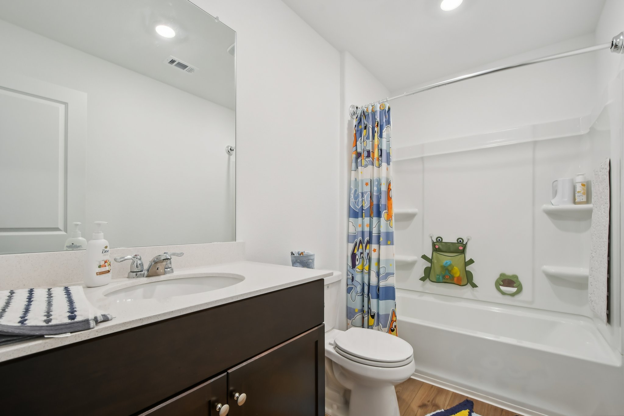 14116 Mussel Run Elgin, TX 78621 - Photo 16 of 25 Full bath featuring vanity, shower / tub combo with curtain, light wood-style floors, and recessed lighting