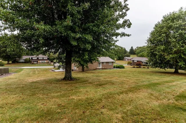a house with swimming pool in front of it