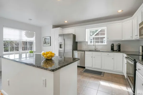 a view of a balcony with furniture