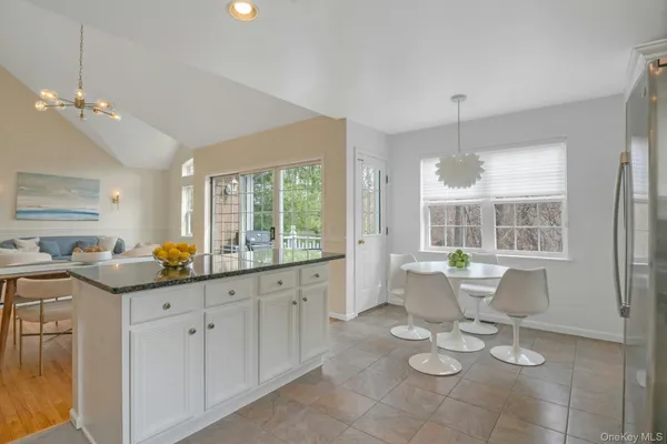 a view of a park with swing and a slide