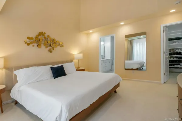 a kitchen with a sink a window and chairs