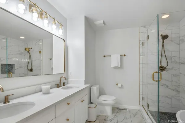 a bedroom with a large bed and a couch