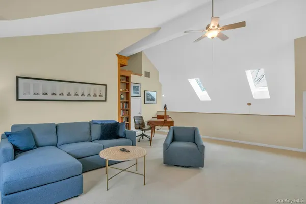 a white bath tub sitting next to a white sink and vanity