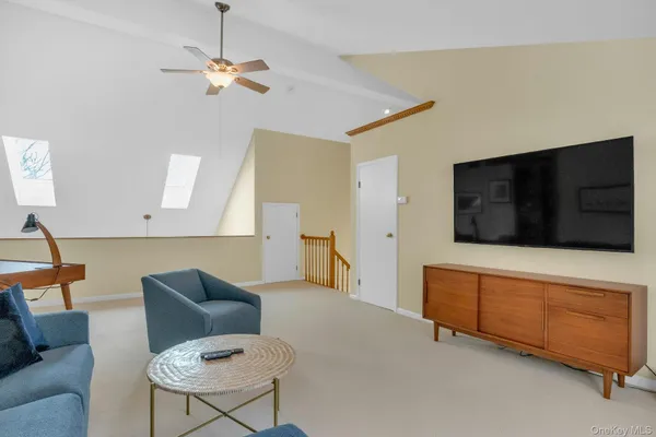 a view of a dining room with furniture wooden floor and chandelier