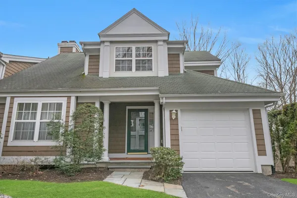 a view of a backyard with wooden fence