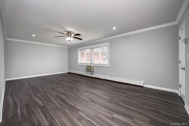58 Horseblock Road, Unit 582A Centereach, NY 11720 - Photo 4 of 8 an empty room with wooden floor and windows