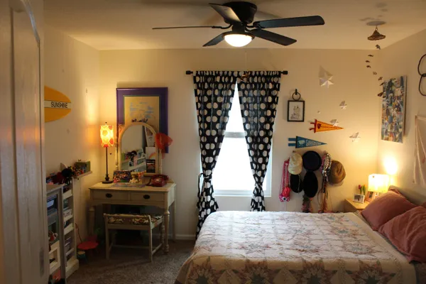 a bathroom with a sink a toilet and shower curtain