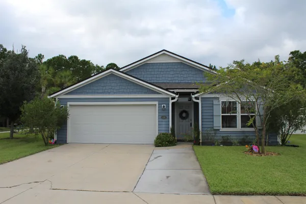 front view of a house with a yard