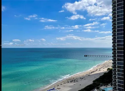 a view of an ocean and a yard