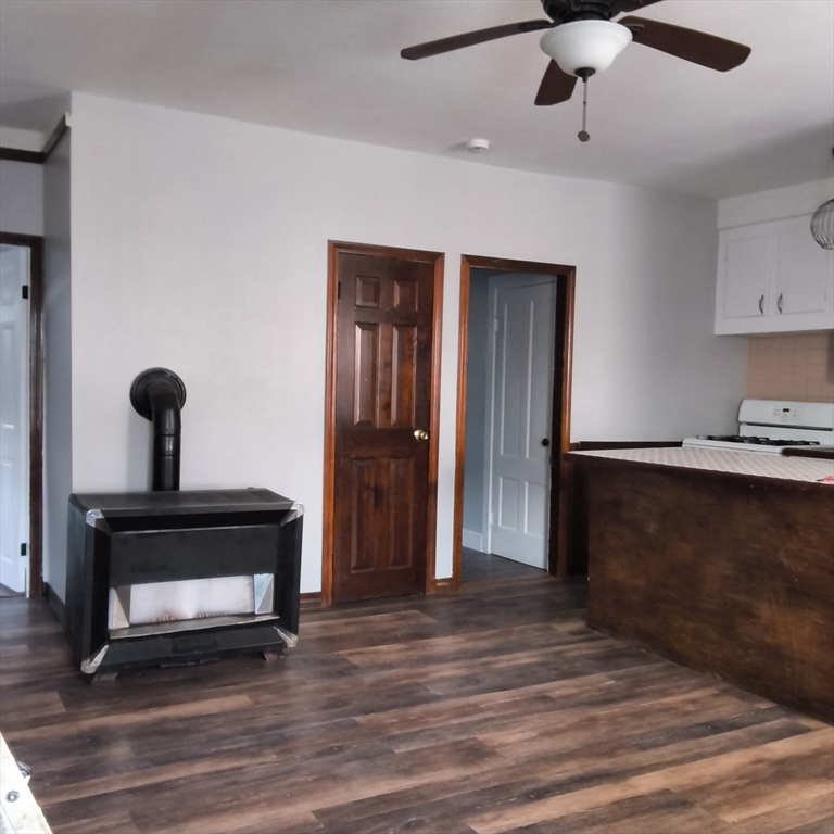 212-218 Lowell Street, Unit 1E Fall River, MA 02721 - Photo 2 of 10 a living room with furniture and a ceiling fan