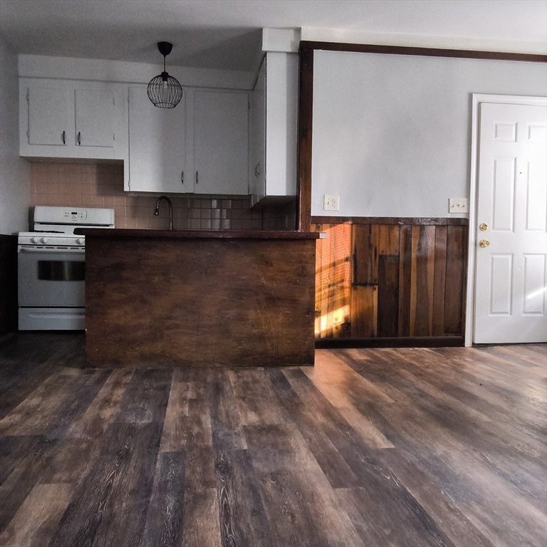 212-218 Lowell Street, Unit 1E Fall River, MA 02721 - Photo 3 of 10 a view of a kitchen with a sink and a stove