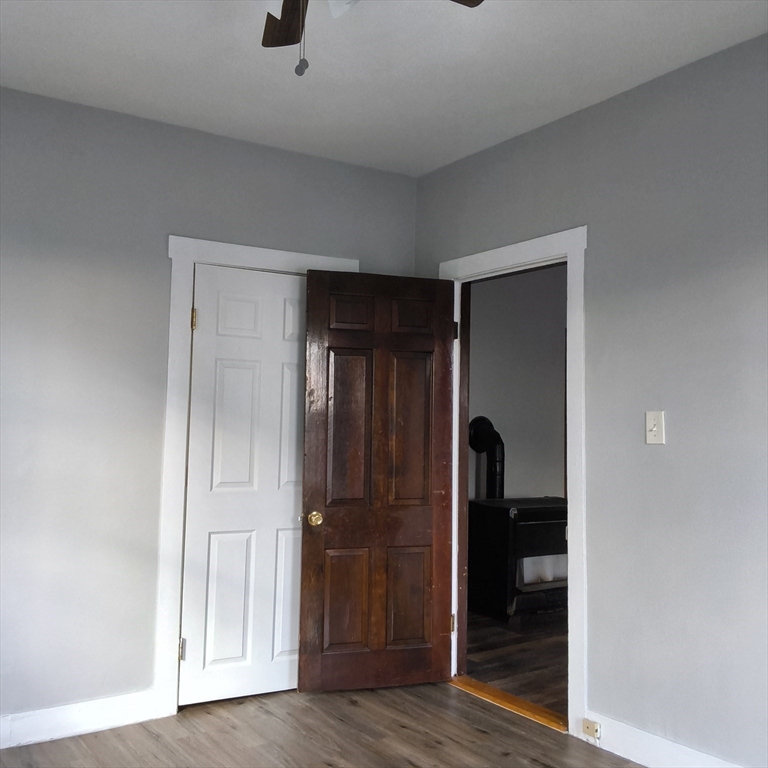 212-218 Lowell Street, Unit 1E Fall River, MA 02721 - Photo 8 of 10 a view of hallway with wooden floor